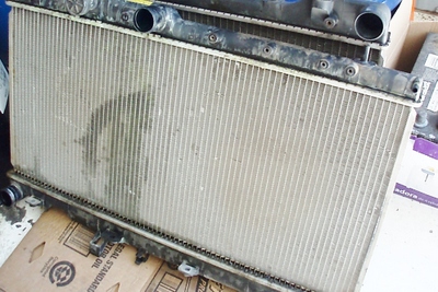 Photo 1: While they might appear in good condition, this stack of scrap ­radiators emphasizes the importance of inspecting for hidden leaks around the header tank seals.